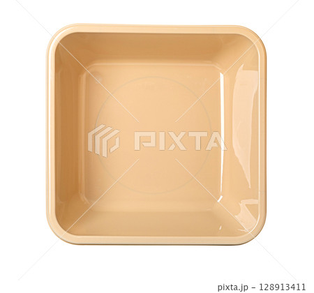 Light brown plastic basin isolated 128913411