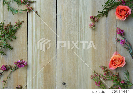 Floral design on rustic wood backdrop perfect for weddings and events 128914444