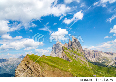 Explore the scenic Seceda ridgeline trail in the Italian Dolomites. 128915079