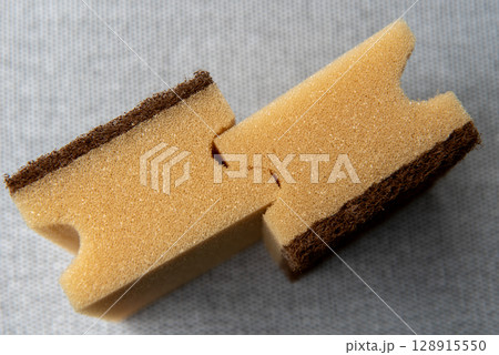 Two Natural-Colored Sponges on Gray Background Two Natural-Colored Sponges on Gray Background 128915550