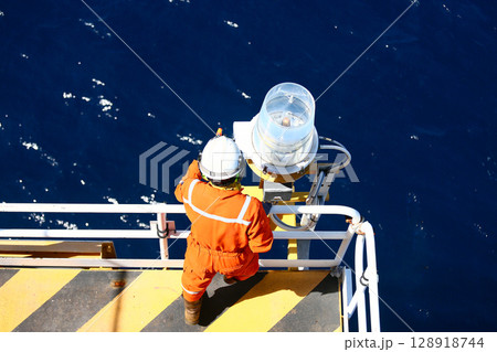 Technician repaired and replaced equipment on oil and gas platform, Performed preventive maintenance and corrective maintenance equipment of oil and gas platform, Safety condition concept. Technician repaired and replaced equipment on oil and gas platform, Performed preventive maintenance and corrective maintenance equipment of oil and gas platform, Safety condition concept. 128918744