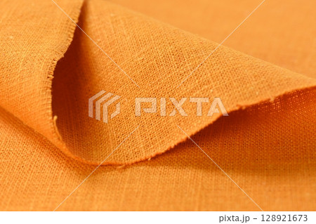 orange hemp viscose natural fabric cloth color, sackcloth rough texture of textile fashion 128921673
