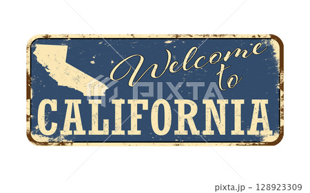 Welcome to California. A worn blue plaque with the name and outline of the state. Welcome inscription on the road sign 128923309