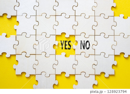 Yes or No symbol. Concept word Yes or No on wooden puzzle. Beautiful yellow background. Business and Yes or No concept. Copy space 128923794