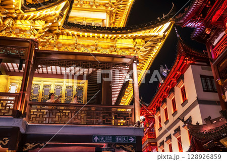 Chinese women play music instrument at yuyuan garden, Shanghai 128926859