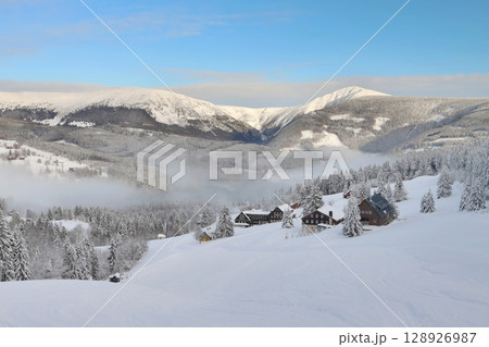 Snowy fairy tale with inverse fog in Giant mountains 128926987