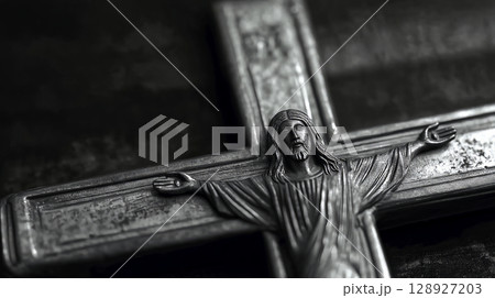 Silver crucifix representing jesus christ on dark background 128927203