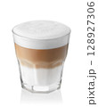 latte or cappuccino with milk foam in transparent glass isolated on white background 128927306