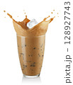 Splash cold coffee with milk and ice in glass isolated on white background 128927743