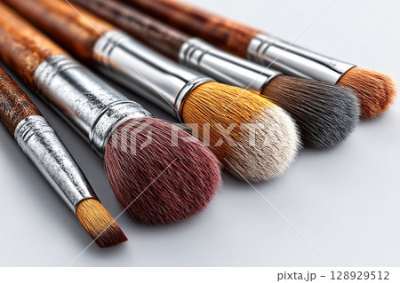 Ideal for beauty brands and product features. Set of high-end makeup brushes on white background. Ideal for beauty brands and product features. Set of high-end makeup brushes on white background. 128929512