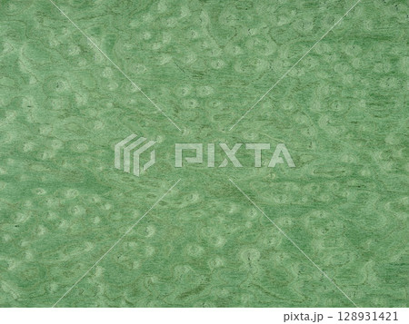 A tranquil sea of jade washes over this unique poplar burl veneer, with waves of verdant tones swirling in harmony 128931421