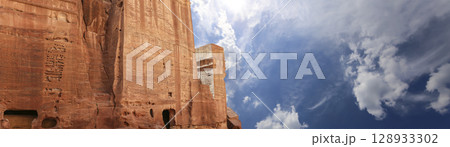 Mountains of Petra (against the background of a beautiful sky with clouds), Jordan, Middle East. Petra has been a UNESCO World Heritage Site since 1985 Mountains of Petra (against the background of a beautiful sky with clouds), Jordan, Middle East. Petra has been a UNESCO World Heritage Site since 1985 128933302