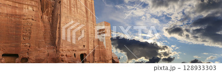 Mountains of Petra (against the background of a beautiful sky with clouds), Jordan, Middle East. Petra has been a UNESCO World Heritage Site since 1985 128933303