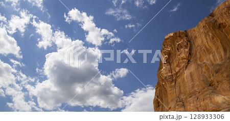 Mountains of Petra (against the background of a beautiful sky with clouds), Jordan, Middle East. Petra has been a UNESCO World Heritage Site since 1985 Mountains of Petra (against the background of a beautiful sky with clouds), Jordan, Middle East. Petra has been a UNESCO World Heritage Site since 1985 128933306