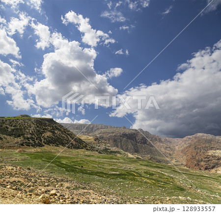 Typical mountain landscape, Jordan, Middle East  (photography from a high point). Against the background of a beautiful sky with clouds 128933557