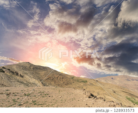 Typical mountain landscape, Jordan, Middle East  (photography from a high point). Against the background of a beautiful sky with clouds 128933573