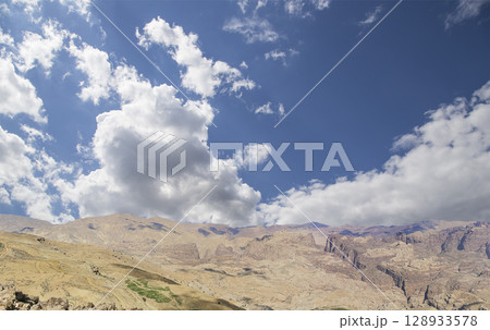 Typical mountain landscape, Jordan, Middle East  (photography from a high point). Against the background of a beautiful sky with clouds 128933578