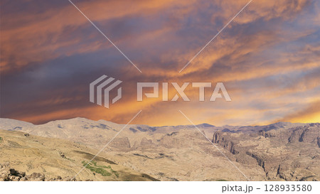 Typical mountain landscape, Jordan, Middle East (photography from a high point). Against the background of a beautiful sky with clouds Typical mountain landscape, Jordan, Middle East (photography from a high point). Against the background of a beautiful sky with clouds 128933580