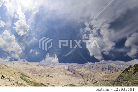 Typical mountain landscape, Jordan, Middle East  (photography from a high point). Against the background of a beautiful sky with clouds 128933581