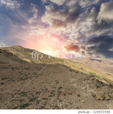 Typical mountain landscape, Jordan, Middle East  (photography from a high point). Against the background of a beautiful sky with clouds 128933590