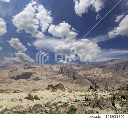 Typical mountain landscape, Jordan, Middle East  (photography from a high point). Against the background of a beautiful sky with clouds 128933592