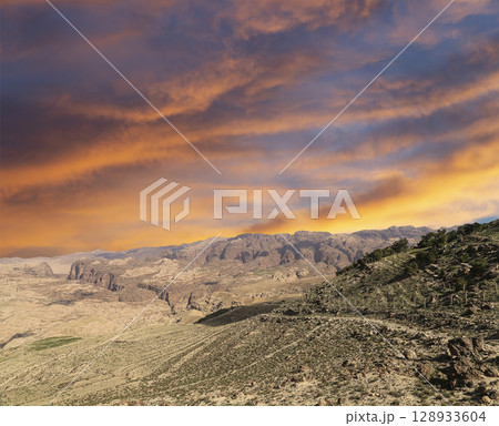 Typical mountain landscape, Jordan, Middle East  (photography from a high point). Against the background of a beautiful sky with clouds 128933604