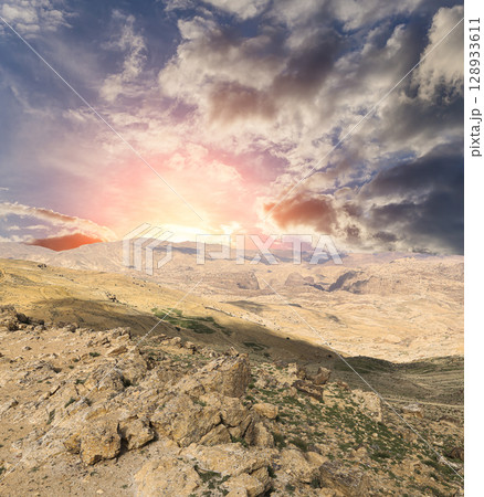 Typical mountain landscape, Jordan, Middle East  (photography from a high point). Against the background of a beautiful sky with clouds 128933611