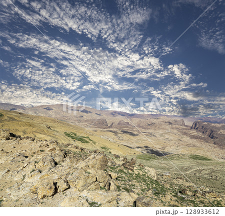 Typical mountain landscape, Jordan, Middle East  (photography from a high point). Against the background of a beautiful sky with clouds 128933612