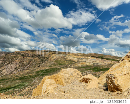 Typical mountain landscape, Jordan, Middle East (photography from a high point). Against the background of a beautiful sky with clouds Typical mountain landscape, Jordan, Middle East (photography from a high point). Against the background of a beautiful sky with clouds 128933633