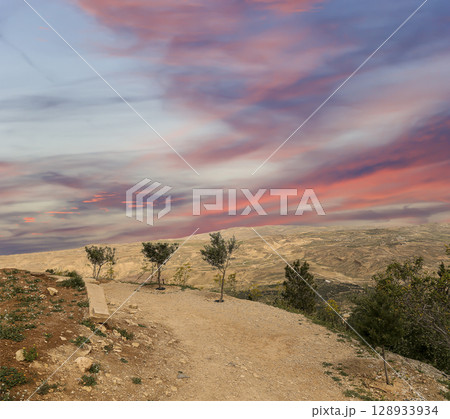 Typical mountain landscape, Jordan, Middle East (photography from a high point). Against the background of a beautiful sky with clouds Typical mountain landscape, Jordan, Middle East (photography from a high point). Against the background of a beautiful sky with clouds 128933934