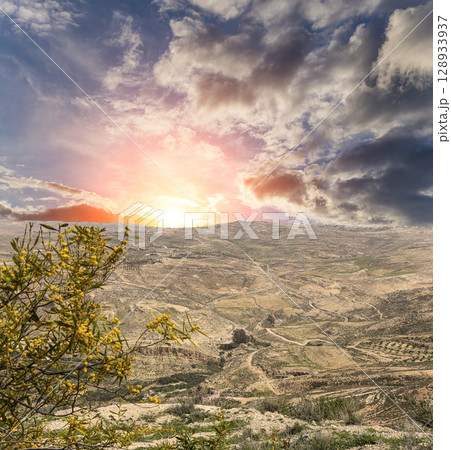 Typical mountain landscape, Jordan, Middle East  (photography from a high point). Against the background of a beautiful sky with clouds 128933937