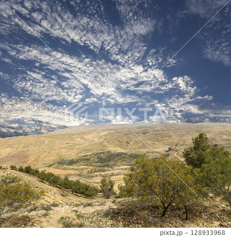 Typical mountain landscape, Jordan, Middle East  (photography from a high point). Against the background of a beautiful sky with clouds 128933968