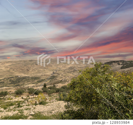 Typical mountain landscape, Jordan, Middle East  (photography from a high point). Against the background of a beautiful sky with clouds 128933984