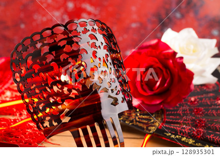 Flamenco comb fan and roses typical from Spain Espana 128935301
