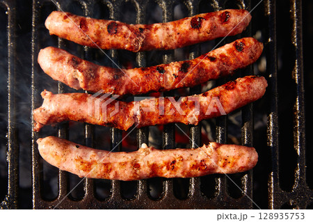 Barbecue sausages in a row Barbecue sausages in a row 128935753