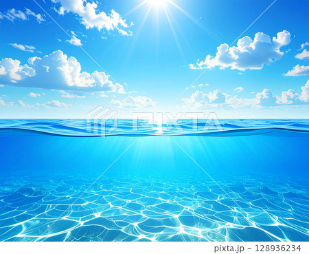 太陽が輝く雲が浮かぶ青空とキラキラと輝く水面が美しい水平線の海 128936234