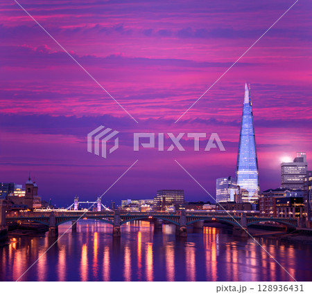 London skyline sunset on Thames river 128936431
