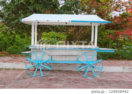 Icecream hot dogs cart white blue in Caribbean island Icecream hot dogs cart white blue in Caribbean island 128936442