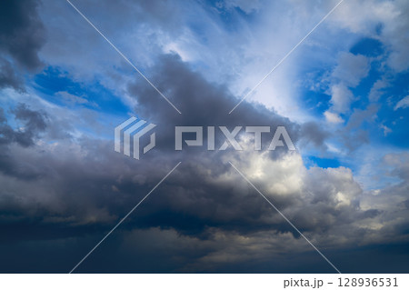 Dramatic clouds sky in a stormy weather 128936531