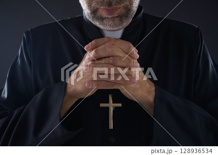 Praying hands priest portrait of pastor 128936534