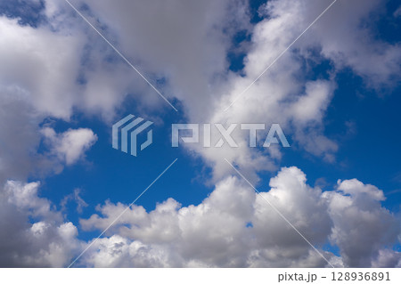 Blue summer sky white cumulus clouds 128936891