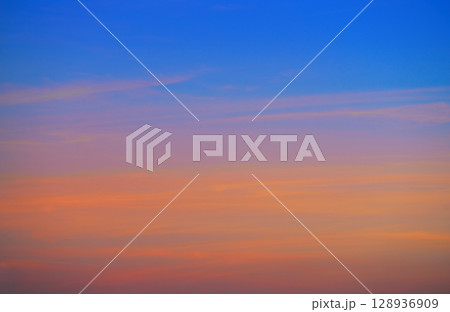 Sunset sky clouds orange and blue Sunset sky clouds orange and blue 128936909