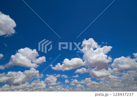 Blue sky with summer clouds Blue sky with summer clouds 128937237