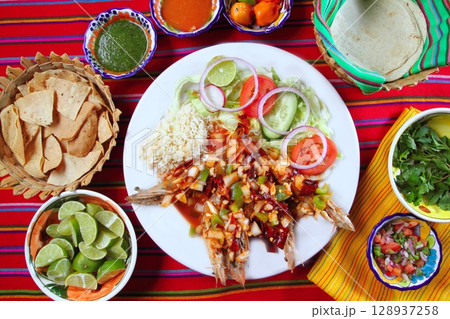 Guajillo chili shrimps Mexican dish chili sauces 128937258