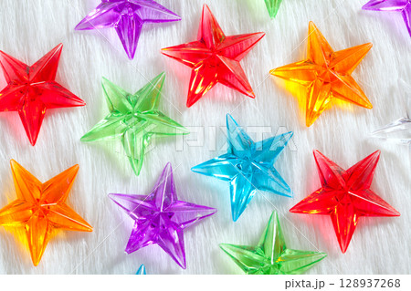 christmas colorful glass stars over white fur 128937268
