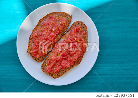 Bread toasted slices with grated tomato Bread toasted slices with grated tomato 128937551