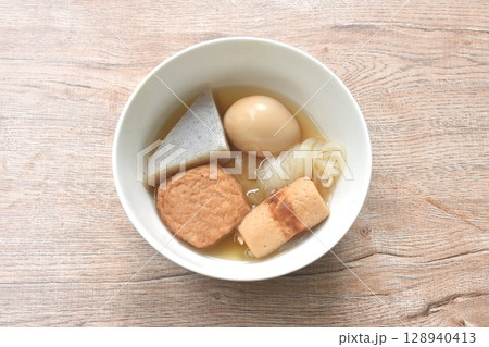 boiled Oden or fish ball and egg in clear soup Japanese food on bowl 128940413