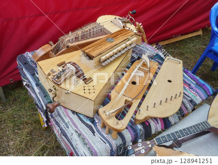 Traditional vintage stringed musical instruments on a colorful mat 128941251