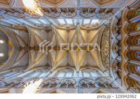 Intricate details of the Gothic architecture are showcased in the ceiling of Westminster Abbey. This landmark, located in London, features stunning designs and stained glass windows. Intricate details of the Gothic architecture are showcased in the ceiling of Westminster Abbey. This landmark, located in London, features stunning designs and stained glass windows. 128942062