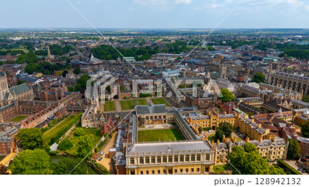 Cambridge University campus and city skyline showing historic buildings and green spaces on sunny Cambridge University campus and city skyline showing historic buildings and green spaces on sunny 128942132